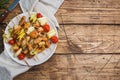 Kebab chicken, zucchini and tomatoes on skewers in a plate. Wooden table. Copy space Royalty Free Stock Photo