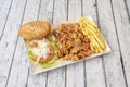 Kebab menu tray complete with chopped roast chicken, side of French fries, iceberg lettuce salad, Royalty Free Stock Photo