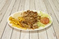 Kebab menu tray complete with french fries, basmati rice, minced roast chicken meat, onion and iceberg lettuce with tomato on Royalty Free Stock Photo