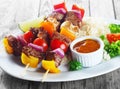 Kebab on Sticks with Sauce on Plate with Rice Royalty Free Stock Photo