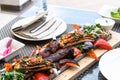 Kebab with vegetables and pita bread - traditional Turkish dish. Cooked on fire Royalty Free Stock Photo