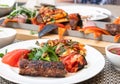 Kebab with vegetables and pita bread - traditional Turkish dish. Cooked on fire Royalty Free Stock Photo