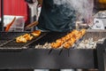 Kebabs, meat on skewers prepared on bbq grill with smoke Close-up outdoors, backyard barbecue concept Royalty Free Stock Photo