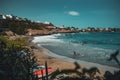 'Kebra Canela' beach. One of the main beaches of Santiago, with people on it and boats on the side.