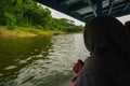 Kebumen, Central Java, Indonesia (12/30/2018) : A woman is riding a boat around the Sempor Dam Royalty Free Stock Photo