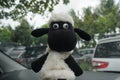 KEBUMEN, INDONESIA Ã¢â¬â AUGUST 2, 2021: A shaun the sheep doll who is sitting and relaxing