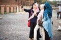 Asian hijab girl taking photo