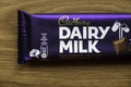 KEDAH,MALAYSIA - MARCH 6TH,2021 : Cadbury Dairy Milk chocolate bar on wooden background. Cadbury Dairy Milk is a brand of milk