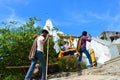 KEDARNATH, AMARNATH, INDIA, Kashmiri porters carry Tourists seated in sedan chair