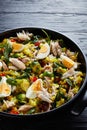 Kedgeree with flaked smoked fish in a pan