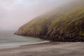 Keem bay and beach in the morning. Low clouds and fog over mountain and water. Calm and moody nature scene. Nobody. Popular travel