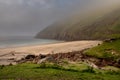 Keem bay and beach in the morning. Low clouds and fog over mountain and water. Calm and moody nature scene. Nobody. Popular travel