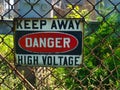 Keep Away DANDER high voltage sign