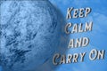 Keep calm and carry on text next the planet on blue sky and white clouds background. Perspective 3D view illustration. Creative Royalty Free Stock Photo