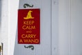 Keep calm and carry a wand gag humor sign hanging on wall