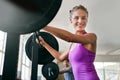 Keep calm and get fit. a young woman working out with weights at the gym. Royalty Free Stock Photo