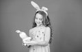 Keep calm and happy Easter. Little girl and rabbit toy. Small girl in rabbit ears with Easter toy. Little child in