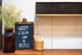 Keep Calm like a Boss hand drawing with chalk on blackboard on working office desk. Motivational Chalkboard Quotes Royalty Free Stock Photo