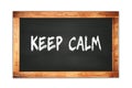 KEEP  CALM Text Written On Wooden Frame School Blackboard