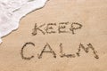 Keep calm written in the sand seashore of tropical beach Royalty Free Stock Photo