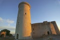 Keep of the castle of Bellver, illuminated by the sunset light