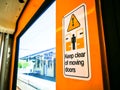 Keep clear of moving doors sign on the train. Royalty Free Stock Photo