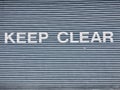 Keep clear sign on garage metal shutter door