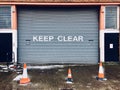 Keep clear sign on garage metal shutter door