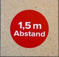 Keep distance symbol in german language. Bitte Abstand Halten! 1.5 meter social distancing sign for COVID-19
