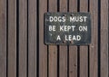 Keep dogs on lead metal sign Royalty Free Stock Photo