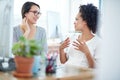 They keep each other motivated at work. two young female designers discussing work in the office. Royalty Free Stock Photo