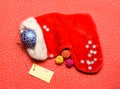 Keep family traditions. Stocking stuffers idea. Santa stocking with christmas decorations. Christmas sock red background