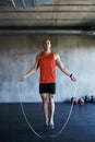 Keep it going. Fitness, jump rope and portrait of man doing gym training, cardio endurance challenge or exercise Royalty Free Stock Photo