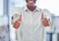 Keep going for glory. Closeup shot of an unrecognisable businesswoman showing thumbs up in an office.