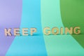 Keep going inscription on colorful background