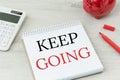 Keep going text on a notice pad. Inspirational concept