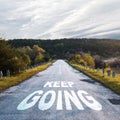 Keep going. Words on the road. Motivation concept Royalty Free Stock Photo