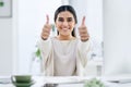 Keep improving on what you do each day. Portrait of a young businesswoman showing thumbs up in an office. Royalty Free Stock Photo