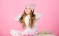 Keep knitwear soft after washing. Soft knitted accessory. Tips for caring for knitted garments. Child long hair warm Royalty Free Stock Photo