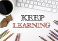 Keep Learning concept. White office desk Royalty Free Stock Photo