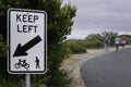 \'Keep left\' sign intended for cyclists and pedestrians on a narrow road in Melbourne Royalty Free Stock Photo