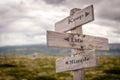 keep life simple text engraved on old wooden signpost outdoors in nature Royalty Free Stock Photo