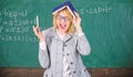 Keep in memory. Improve memory skill. Woman teacher with book as roof on head. Memorizing method. Train memory every day Royalty Free Stock Photo