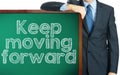 Keep moving forward on blackboard presenting by businessman or t Royalty Free Stock Photo