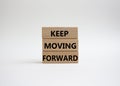 Keep moving forward symbol. Concept words keep moving forward on wooden blocks. Beautiful white background. Business and keep Royalty Free Stock Photo