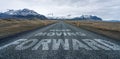 Keep moving forward text quote written on asphalt road leading towards infinity