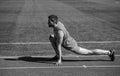 keep moving. sportsman relax. athlete train his flexibility. be flexible. man doing stretching exercise on stadium Royalty Free Stock Photo