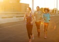 Always keep moving. three friends out jogging in the city in the early morning. Royalty Free Stock Photo