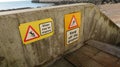 Keep off the groynes steps may be slippery sign. Royalty Free Stock Photo