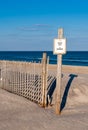 A Keep Off sign and fence on fragile sand dunes Royalty Free Stock Photo